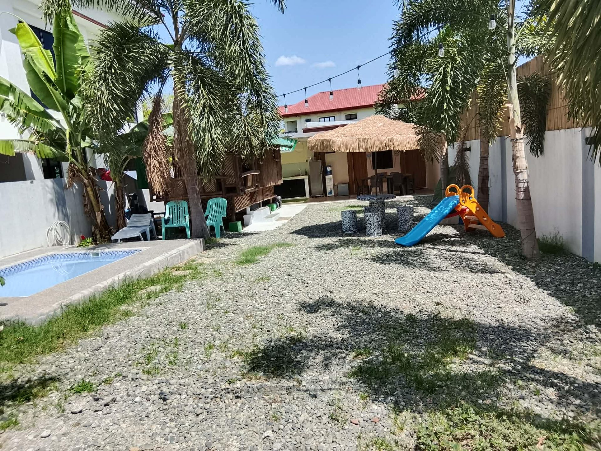 Garden with dipping pool and bamboo kubo